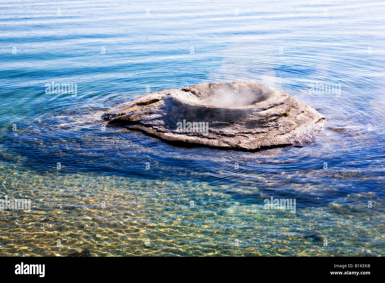 Image looking out over the Fishing Cone thermal feature in the West Geyser Basin in Yellowstone National Park Stock Photo