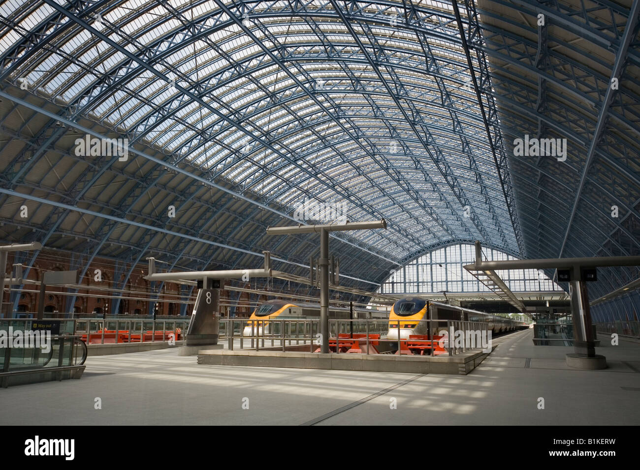 Two Eurostar trains wait in an unusual moment of calm at St Pancras International station in London. Stock Photo