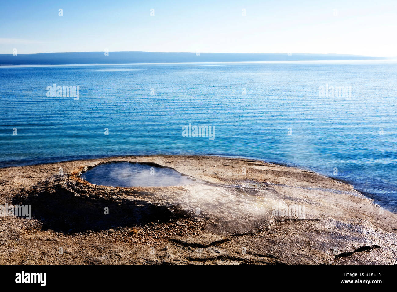 Image looking out over the Fishing Cone thermal feature on the shore of Yellowstone Lake Stock Photo