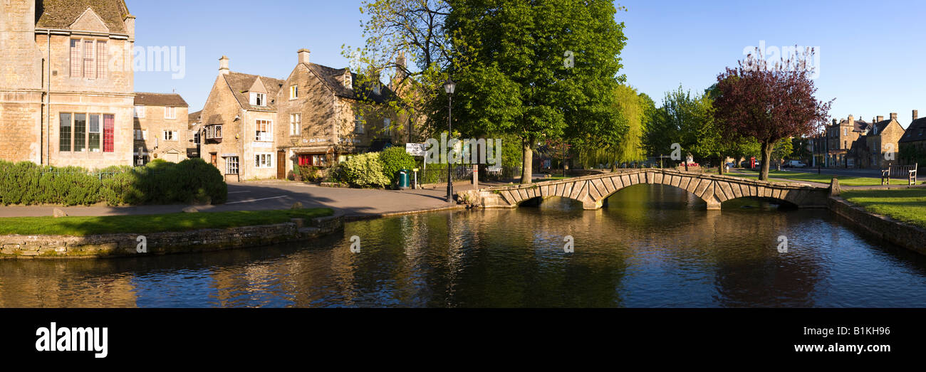 Early morning on the River Windrush flowing through the Cotswold village of Bourton on the Water, Gloucestershire UK Stock Photo