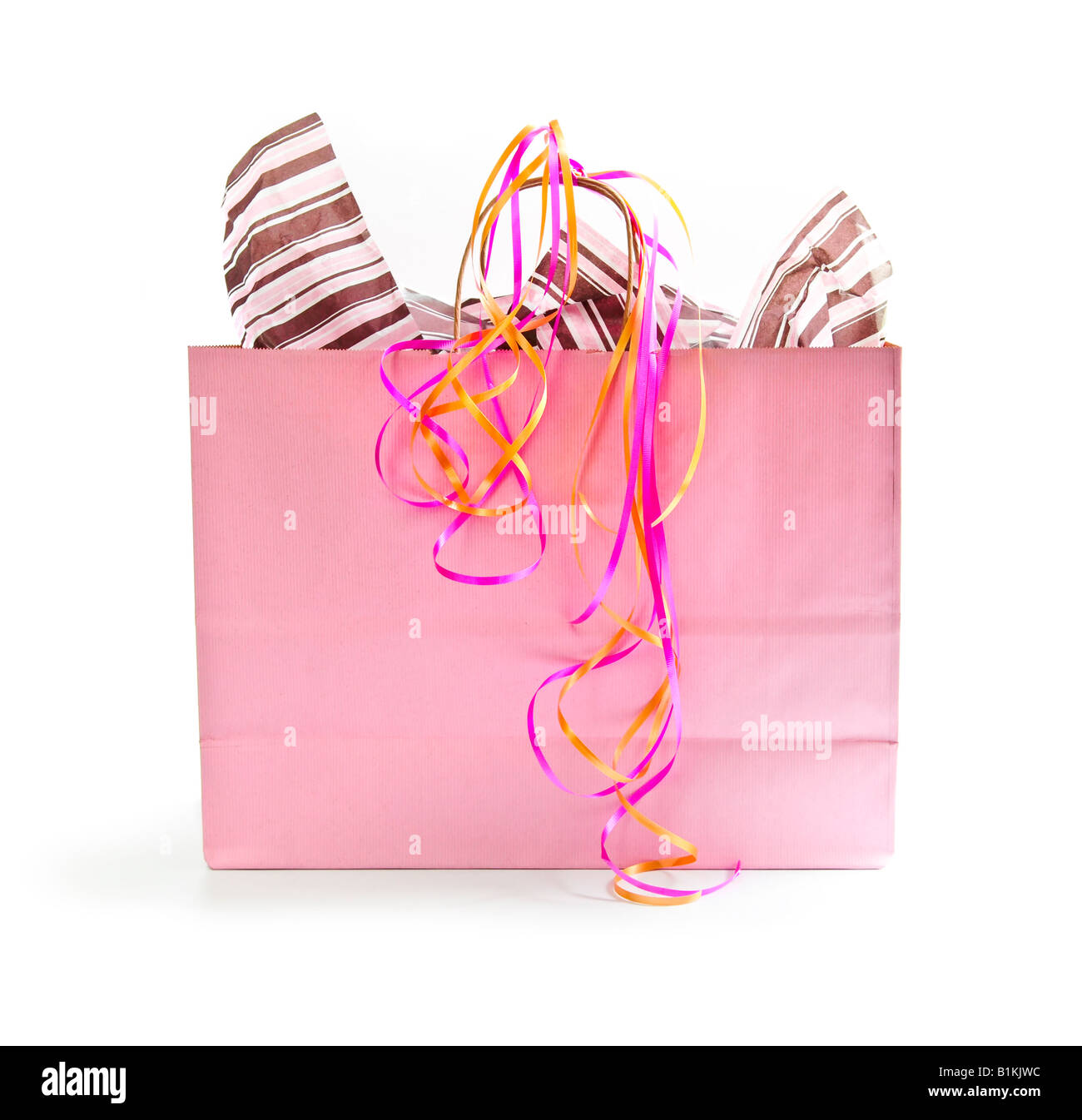 Pink shopping bag with ribbons isolated on white background Stock Photo