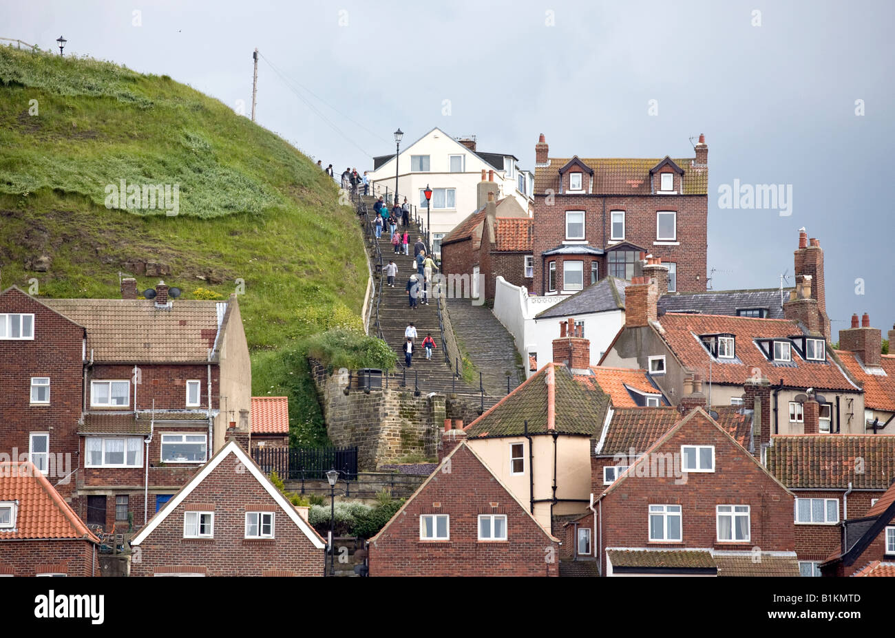 Visitors climb the famous 199 steps in Whitby North Yorkshire England ...