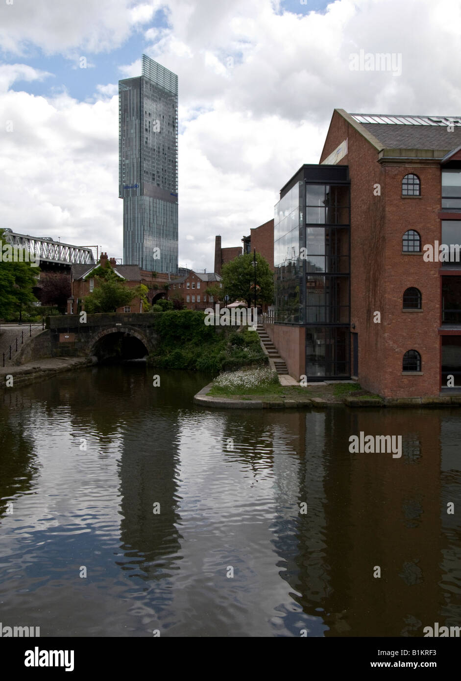 canal and flats with hilton hotel, castlefield, manchester Stock Photo