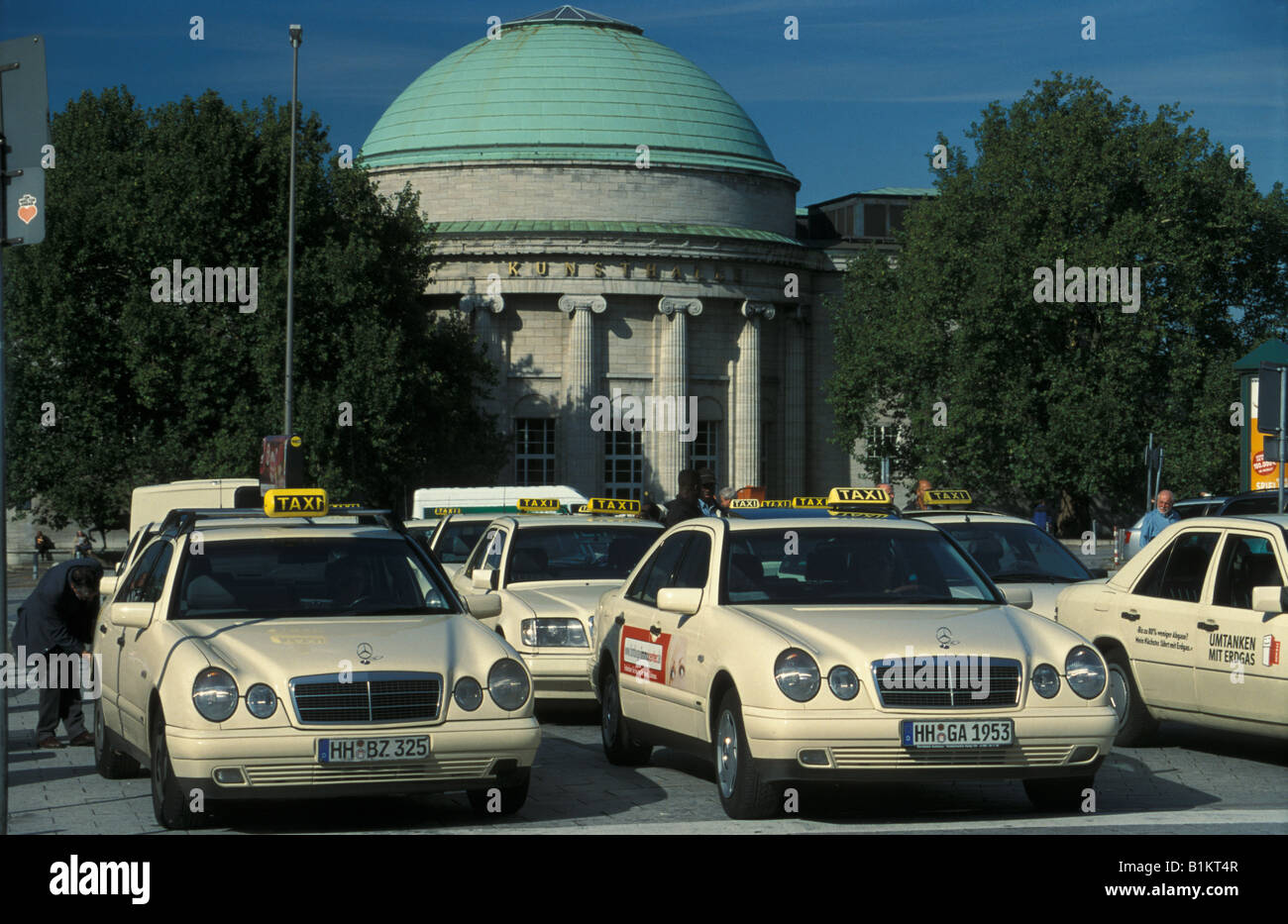 Taxis at the main station in Hamburg, in the background the art gallery, Germany Stock Photo