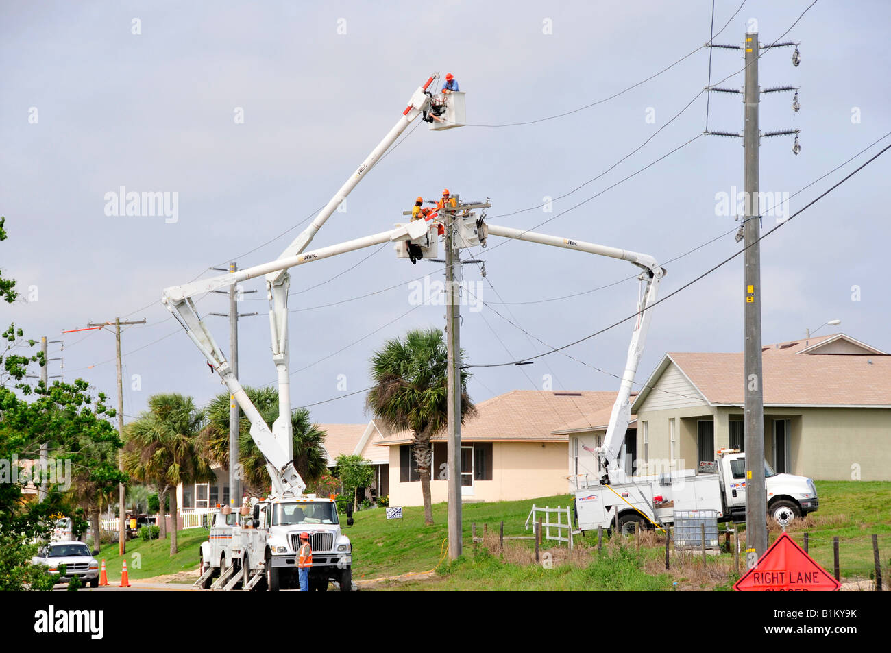 Workers install high tension electrical power lines Lakeland Florida