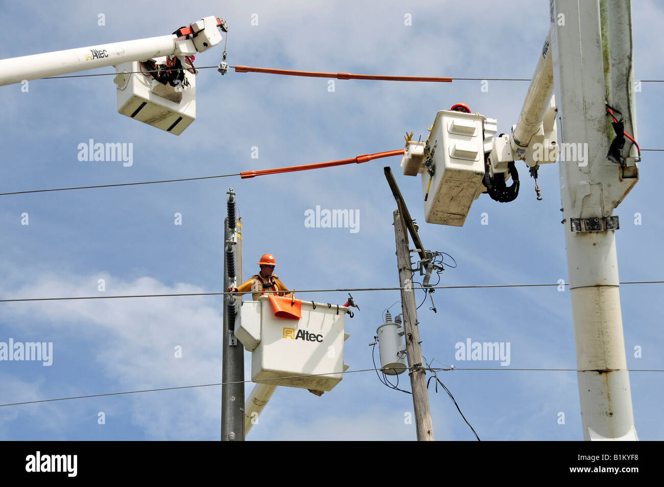 Workers install high tension electrical power lines Lakeland Florida