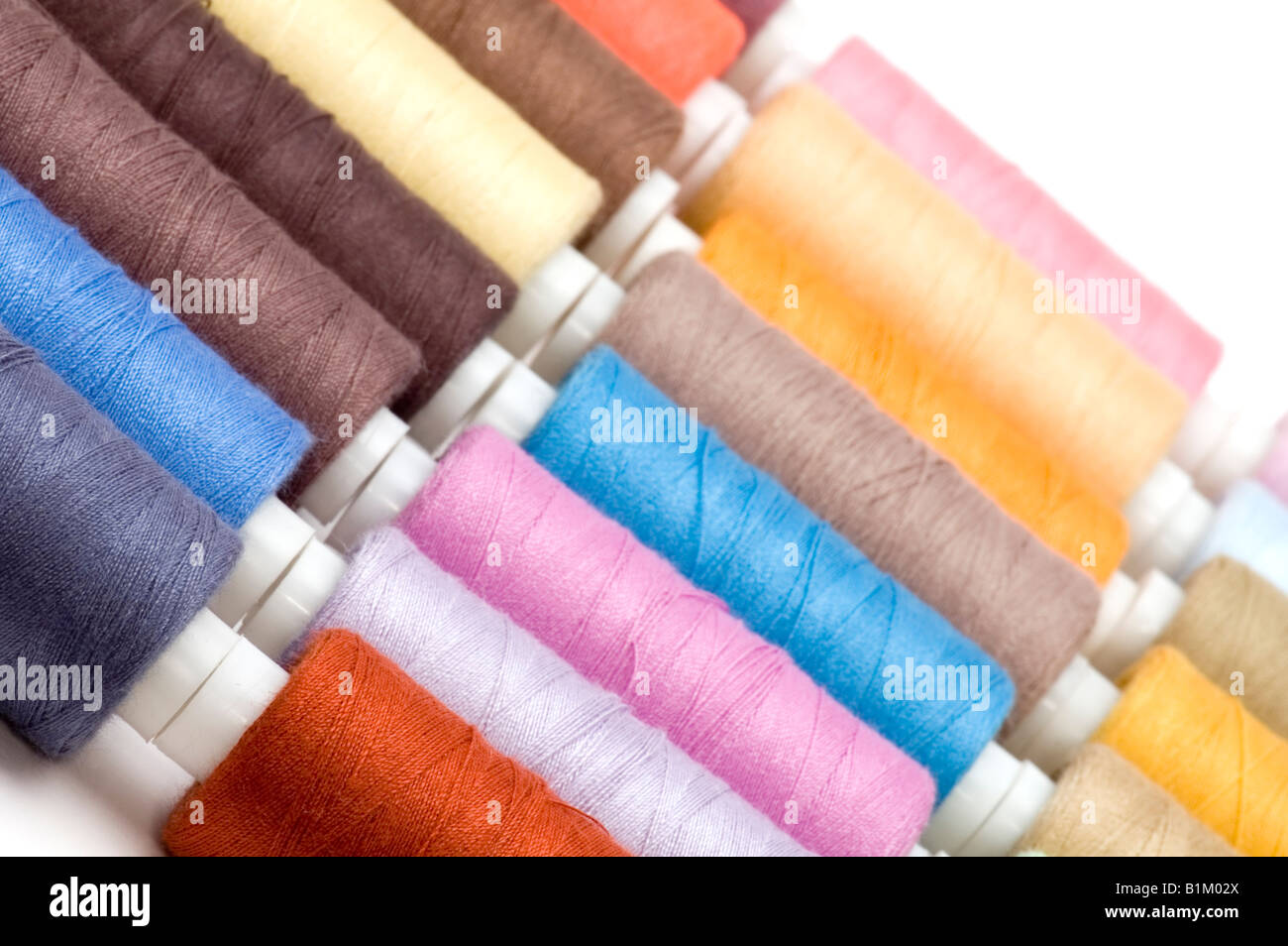object on white sewing cotton rolls Stock Photo - Alamy