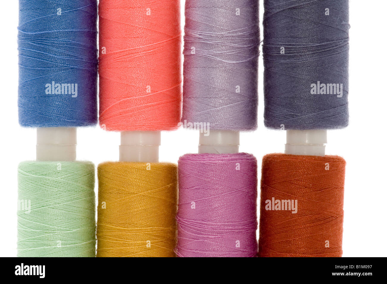 object on white sewing cotton rolls Stock Photo - Alamy