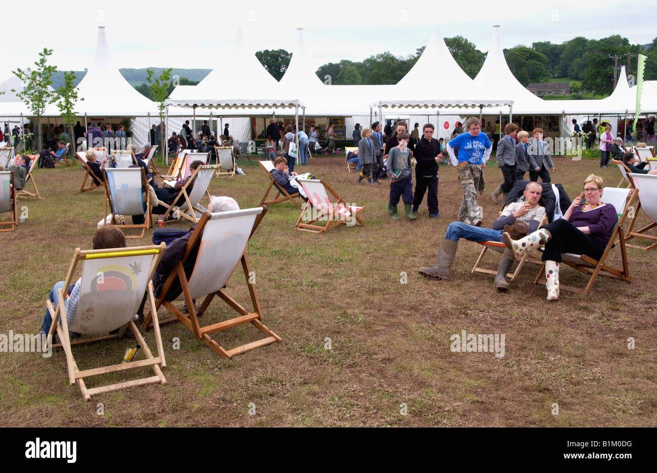 Groups of people sat in deckchairs relaxing at The Guardian Hay Festival 2008 Hay on Wye Powys Wales UK EU Stock Photo