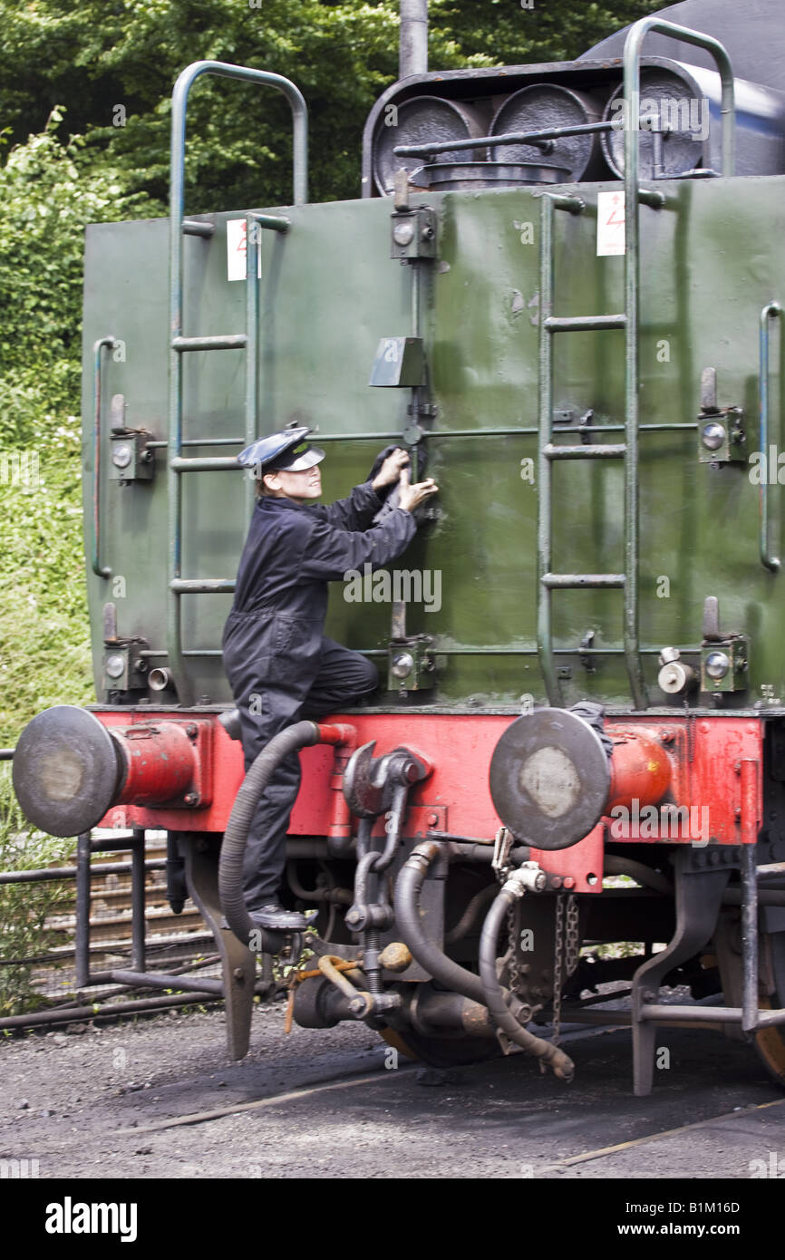 Young Railway Man Cleaning Engine Stock Photo - Alamy