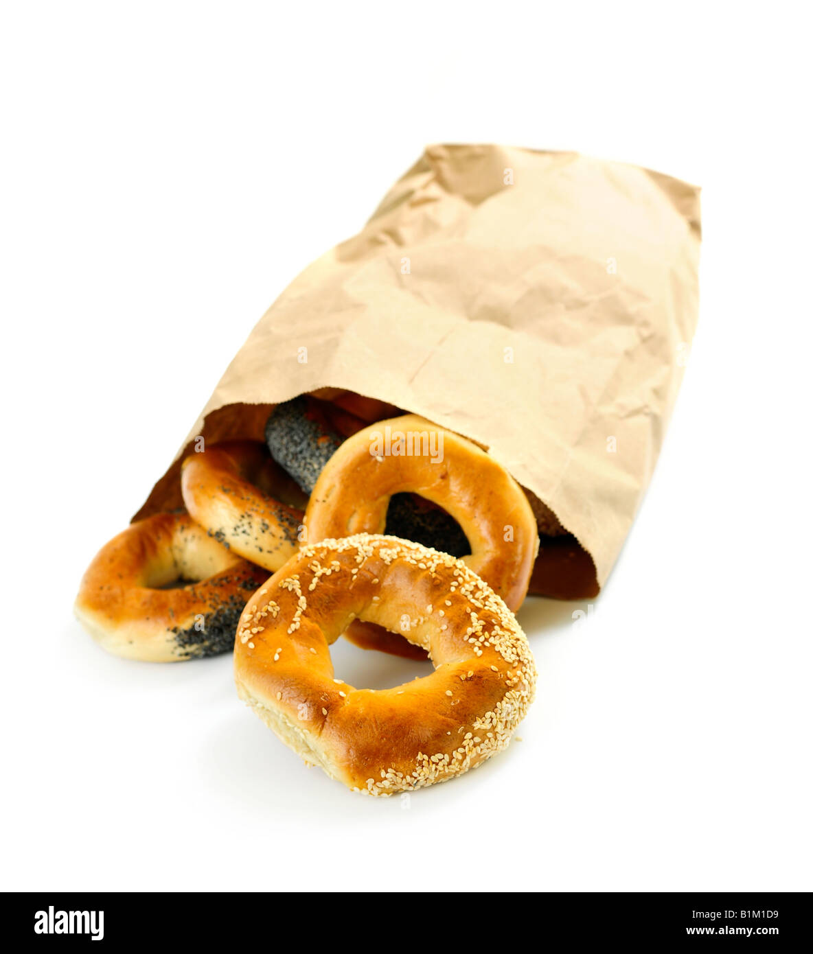 Fresh Montreal style bagels in paper bag on white background Stock Photo
