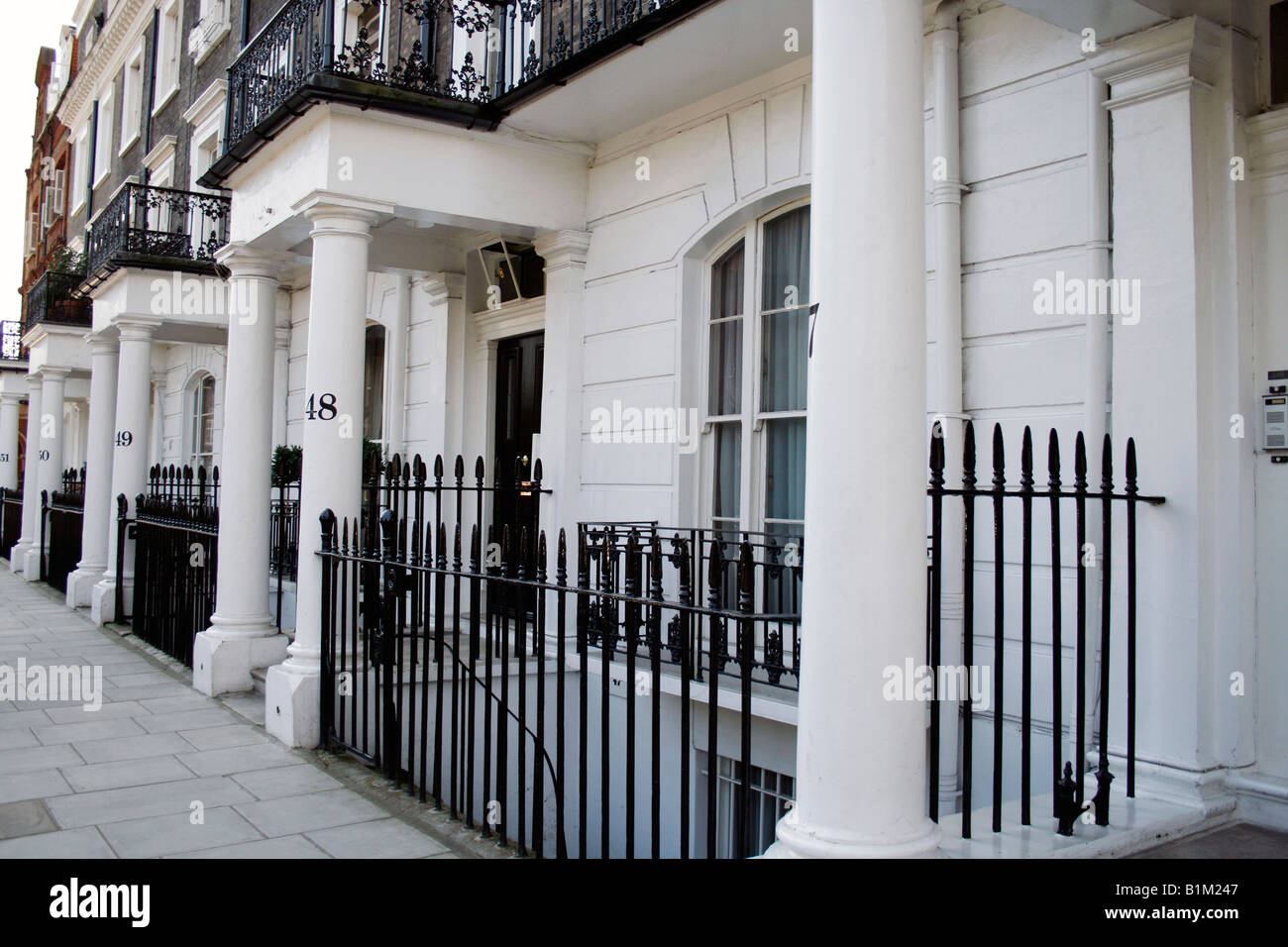 a row of white edwardian houses in a London street Stock Photo