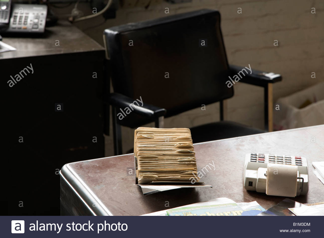 Old Style Chair And Desk With Address Card Filing System In Office