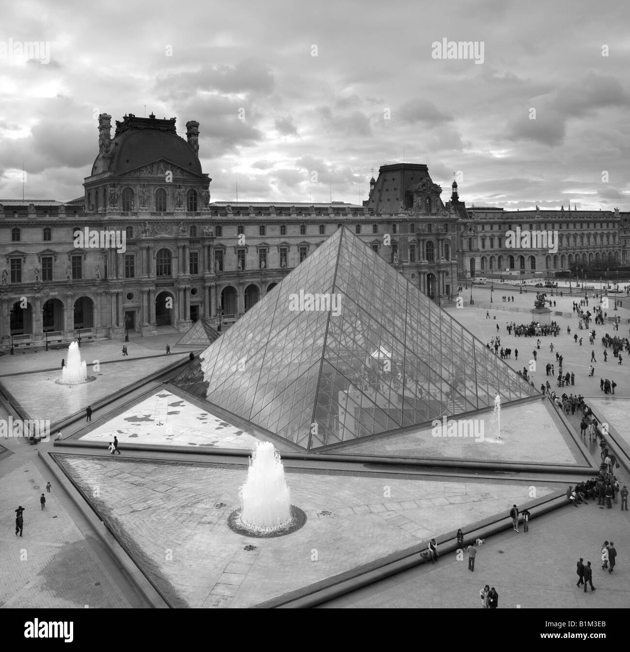 Courtyard and glass pyramid of the Louvre Museum in Paris France Stock Photo