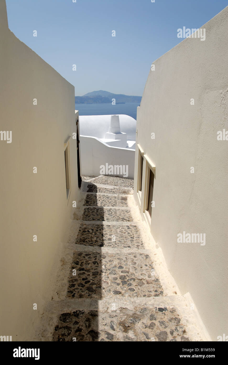 Narrow street in town Oia, Santorini Greece Stock Photo