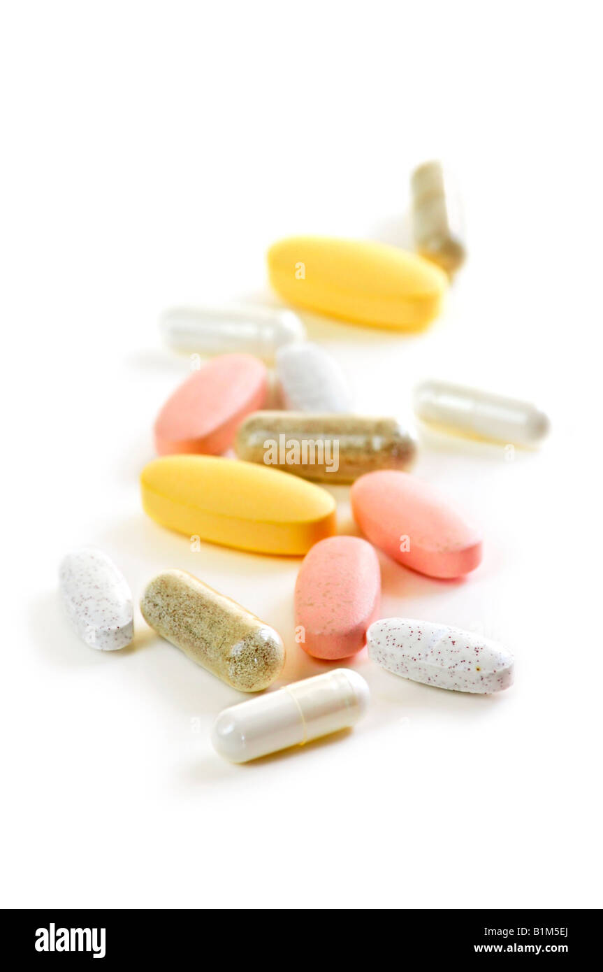 Mix of vitamins and herbal supplements on white background Stock Photo Alamy