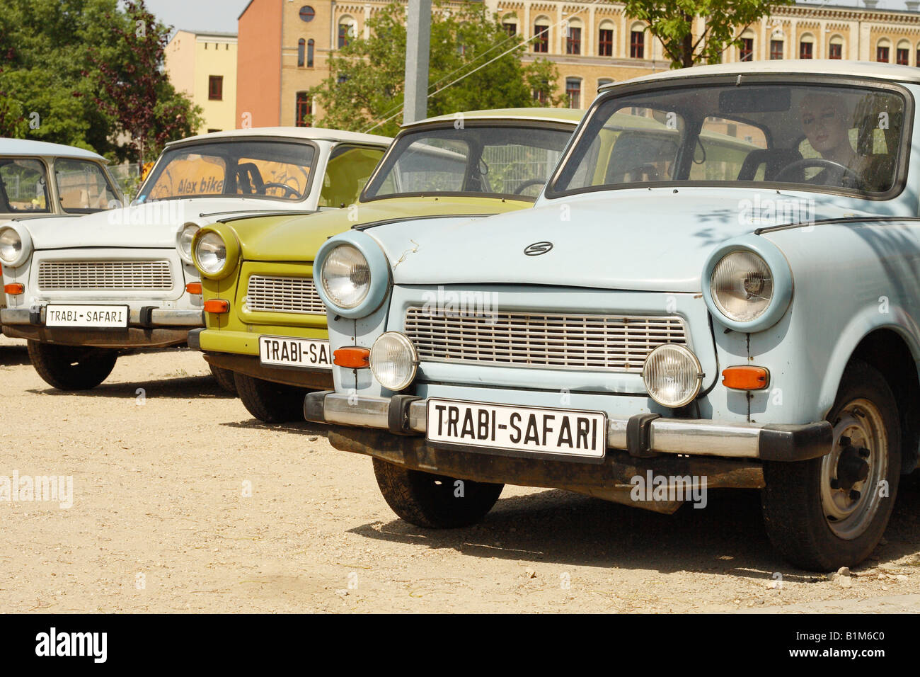 Trabant car symbol of East Germany in Berlin Germany operate tourist sightseeing tours as Trabi Safari Stock Photo