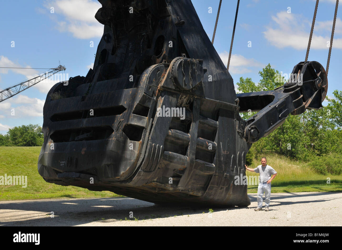 Big Brutus' 90 incn cubic yard shovel with a full sized man standing next to it. Stock Photo