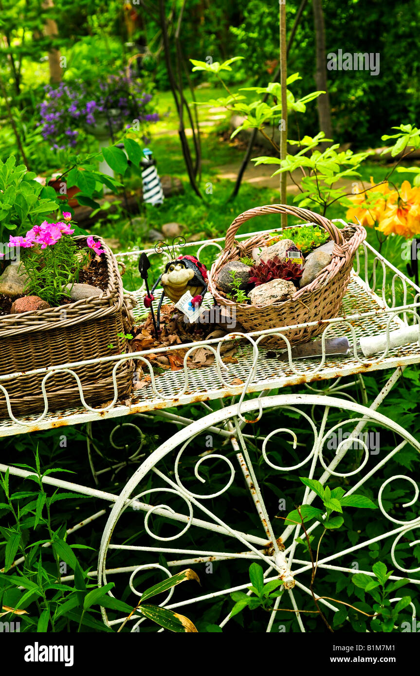 Flower cart with two baskets in summer garden Stock Photo Alamy