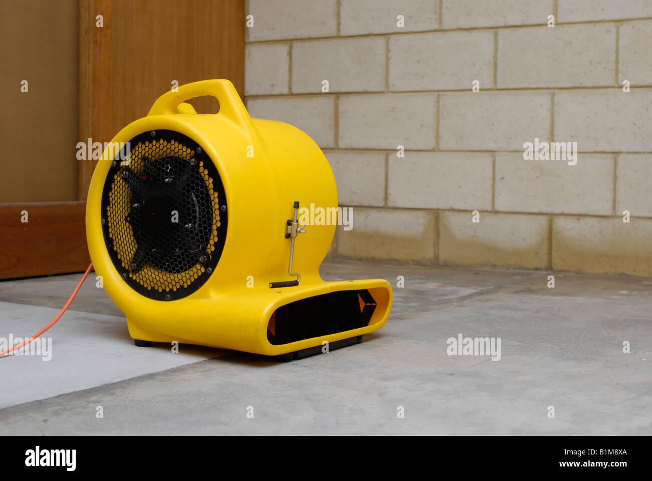 Air Blower Fan Drying A Flood Damaged Room Stock Photo