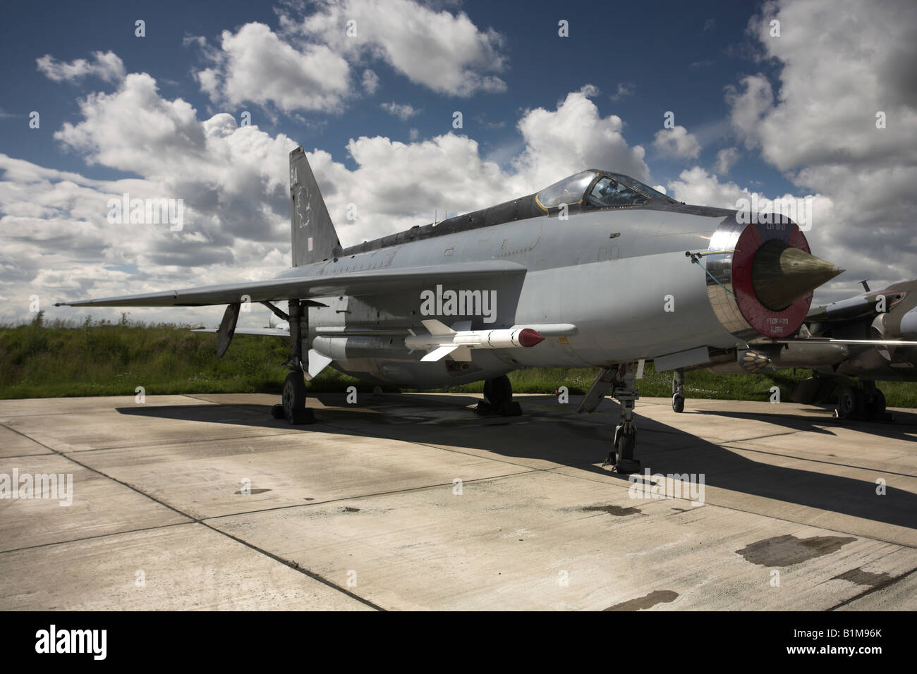 British/English Electric Lightning with sidewinder missiles parked on airfield. Stock Photo