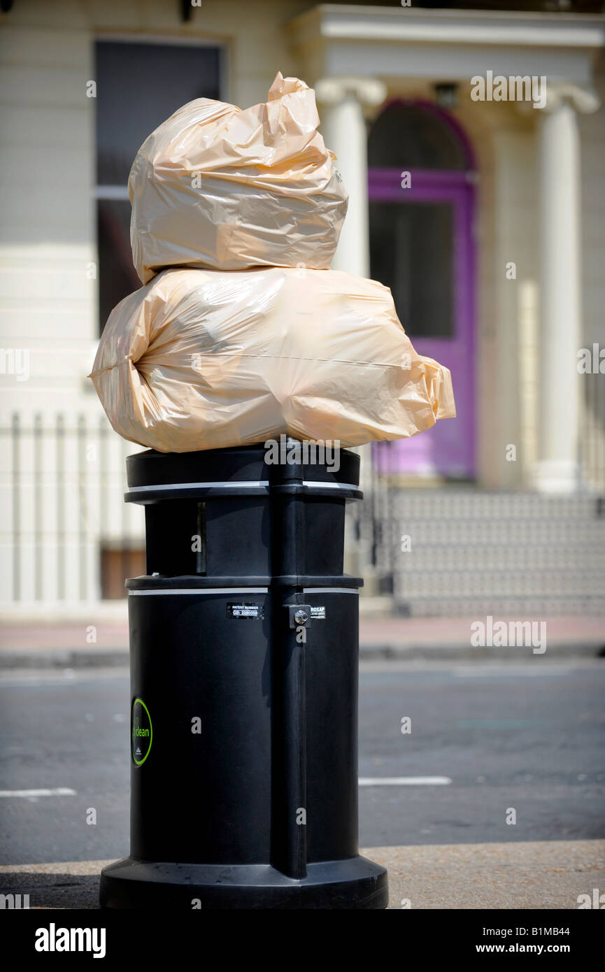 Bags of rubbish sit on top of a Brighton rubbish bin ready for collection. Picture by Jim Holden. Stock Photo