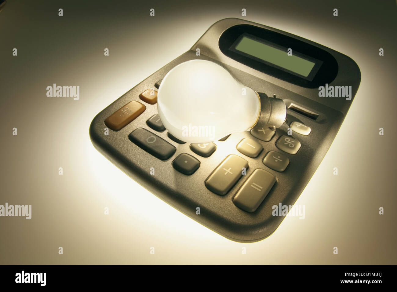 Light Bulb on Calculator Stock Photo Alamy