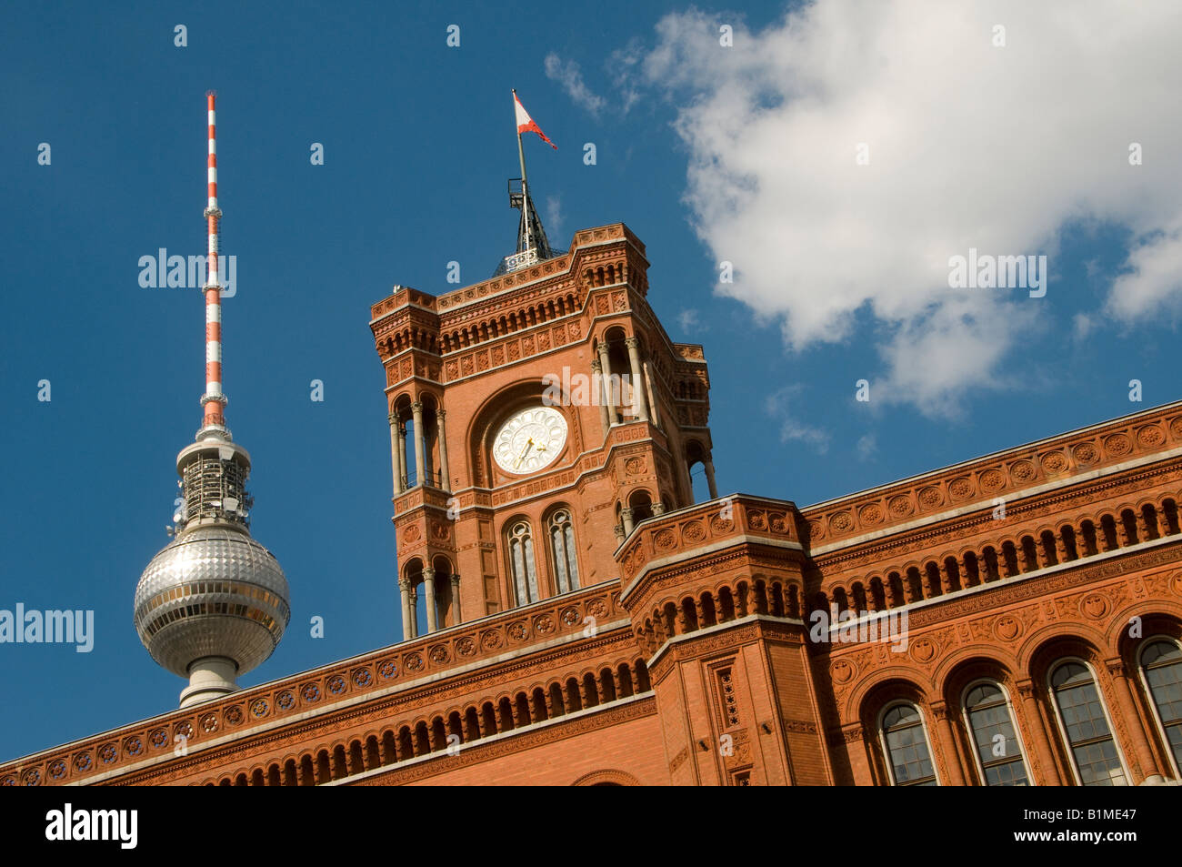 The Berliner Rote Rathaus Red Town hall with the Fernsehturm communication antenna Mitte Quarter Scheunenviertel Berlin Germany Stock Photo