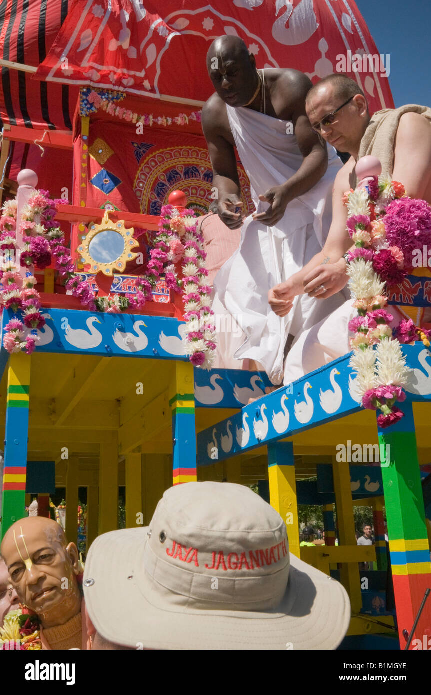 Effigy of A C Bhaktivedanta Swami Prabhupada, founder of ISKCON is lifted to a chariot for the Hare Krishna Rathayatra Festival Stock Photo