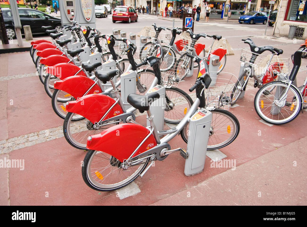Cyclic bike hire payment station and bicycles ready for rental in Rouen