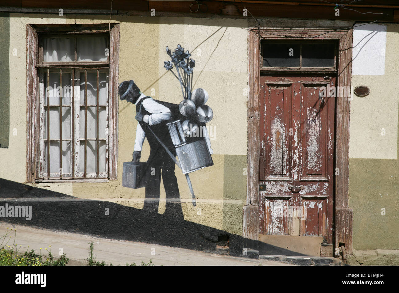 Grafitti on the side of a house in Valparaiso, Chile Stock Photo