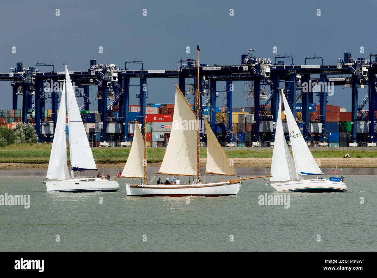Sailing boats on the river Orwell near the Port of Felixstowe, Suffolk, UK. Stock Photo