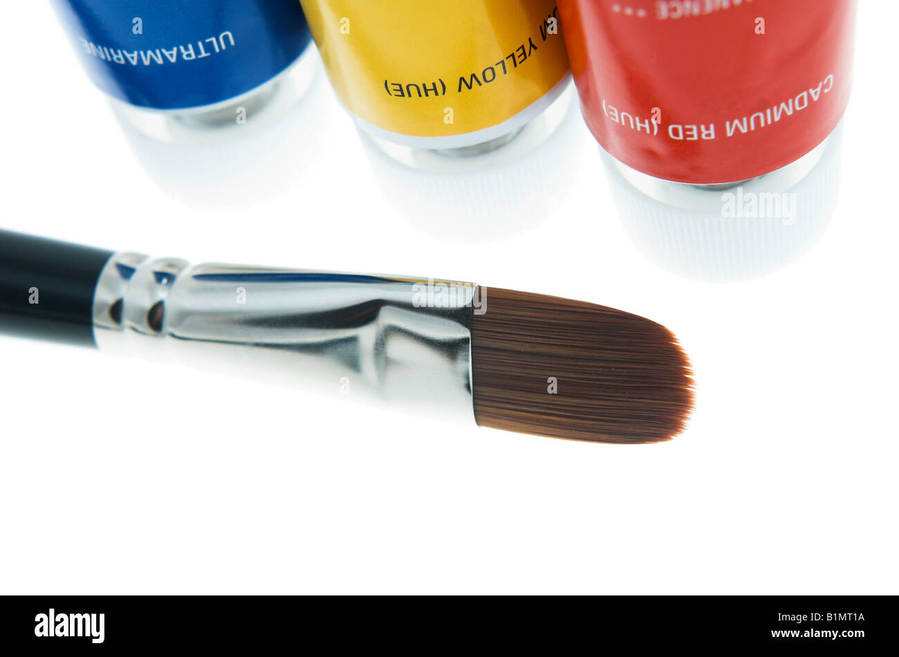 paint brush with blue yellow and red paints Stock Photo - Alamy