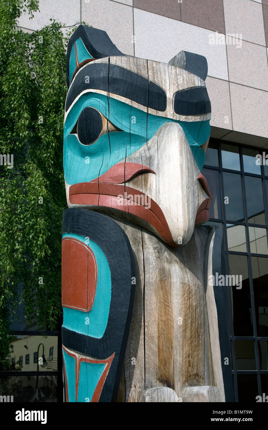 Totem poles in from of Anchorage courthouse, Alaska, USA. Stock Photo