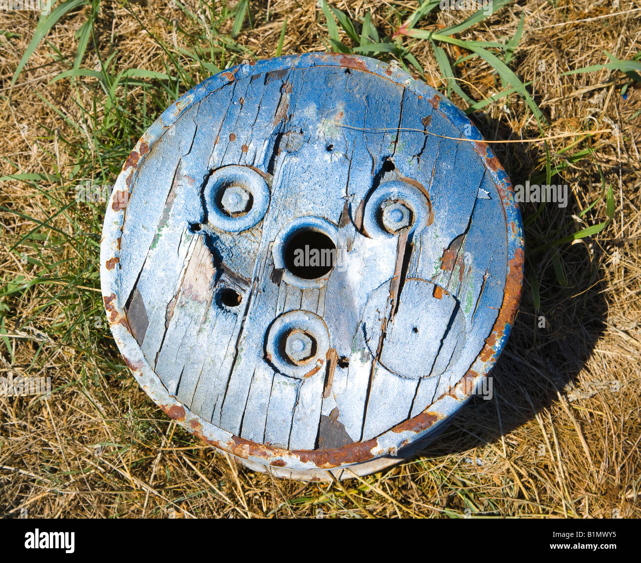 Old round wooden cog lying on ground Stock Photo - Alamy