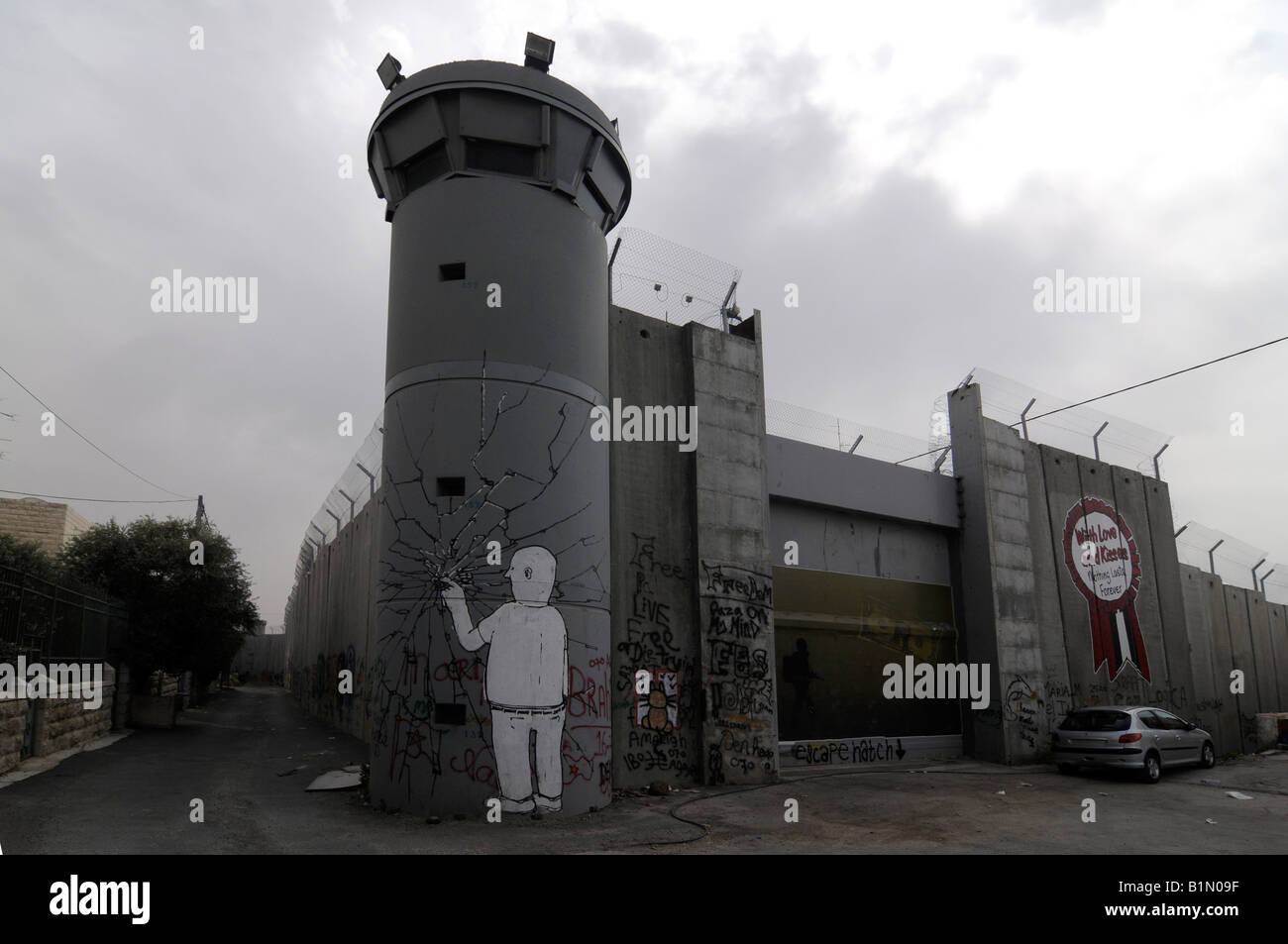 A graffiti on the controversial 'security fence', a wall built by the Israelis to separate themselves from the Palestinians. Stock Photo