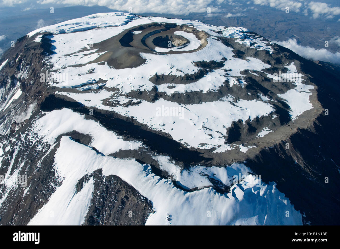 Aerial view of Kilimanjaro 19335 ft. (5895 m) Crater floor with Ash cone and pit, Southern Ice field (foreground), Tanzania Stock Photo