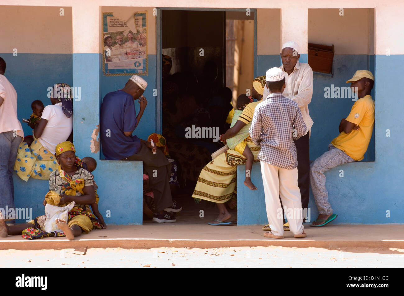 Waiting patients in front of a small clinic in Muxara, near Pemba. Mozambique. Stock Photo