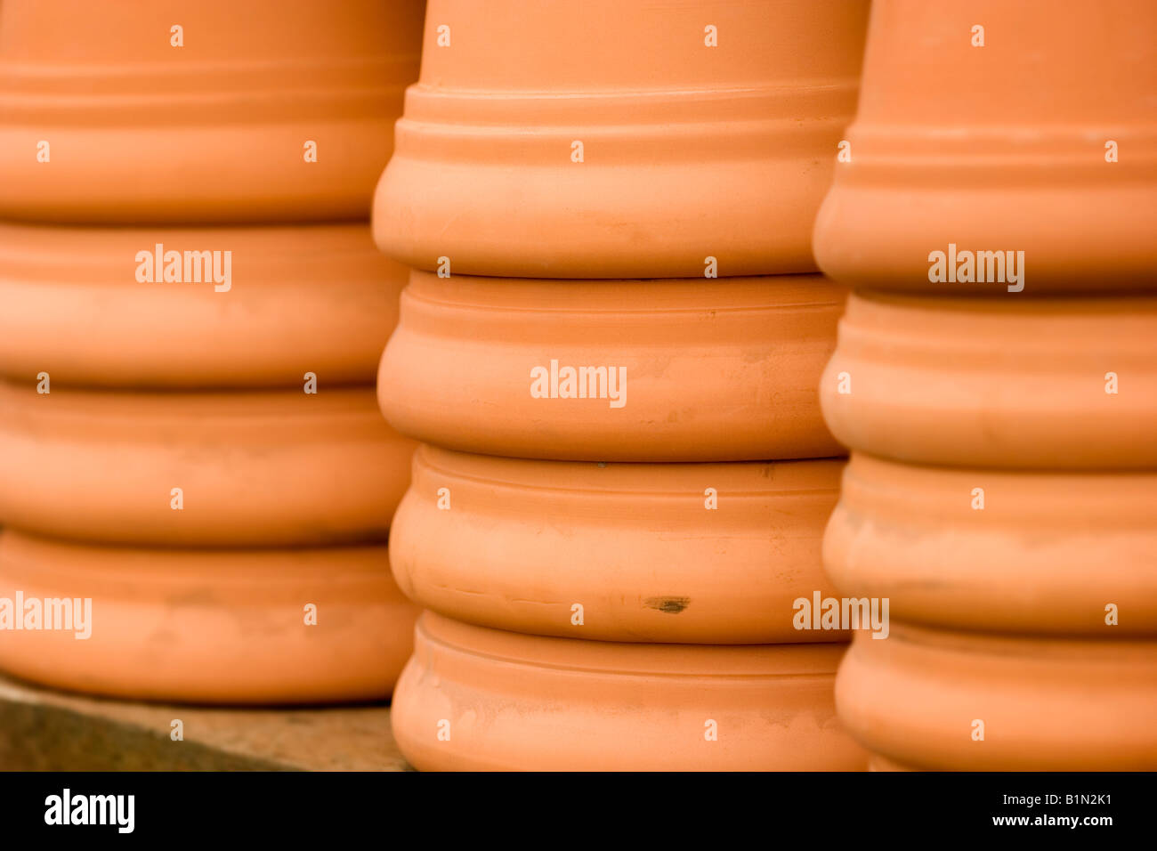 Stacks of clay flower pots in a garden center Stock Photo Alamy