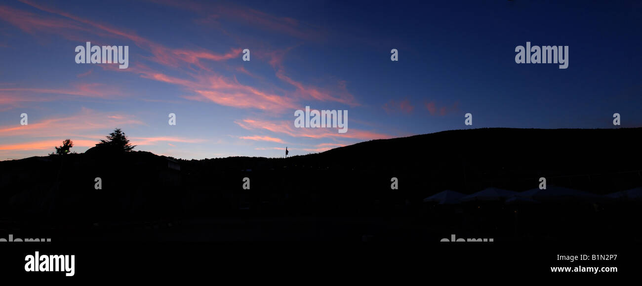 Sunset with mountains as seen from Place 12 Spetembre, Neuchatel; Switzerland Stock Photo
