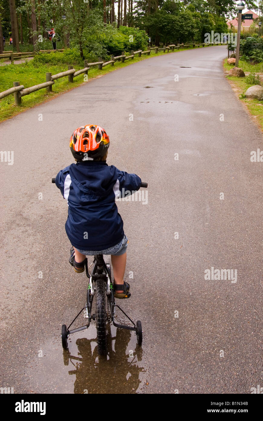 Young Boy Cycling  At Center Parcs at Elveden near Thetford,Uk Stock Photo