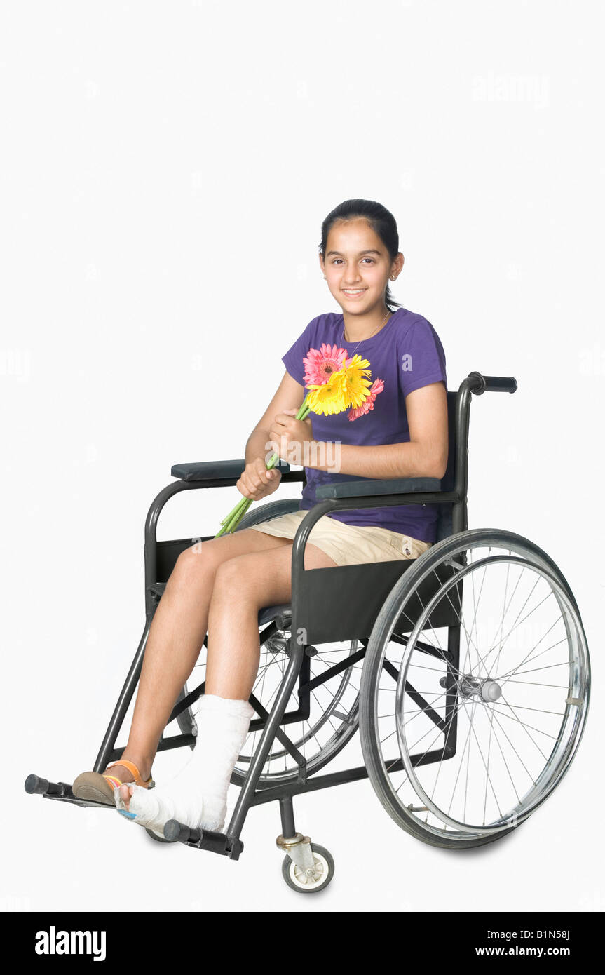 Disabled teenage girl in wheelchair hires stock photography and images