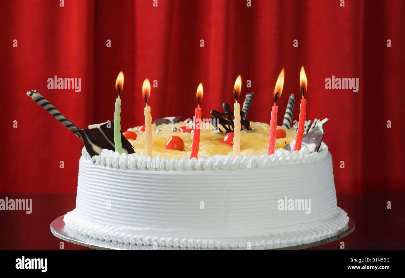 Close-up of lit candles on a birthday cake Stock Photo - Alamy