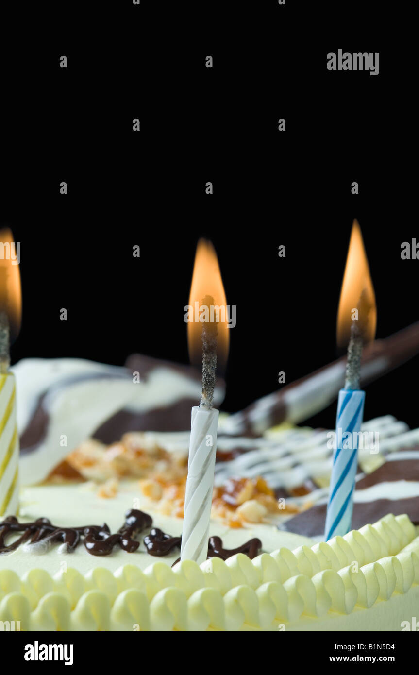 Close-up of lit candles on a birthday cake Stock Photo - Alamy