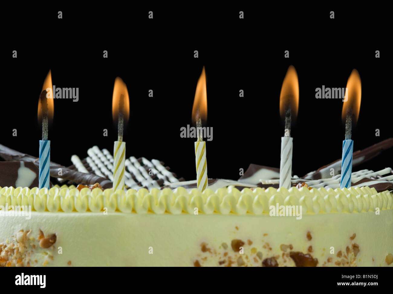 Close-up of lit candles on a birthday cake Stock Photo - Alamy