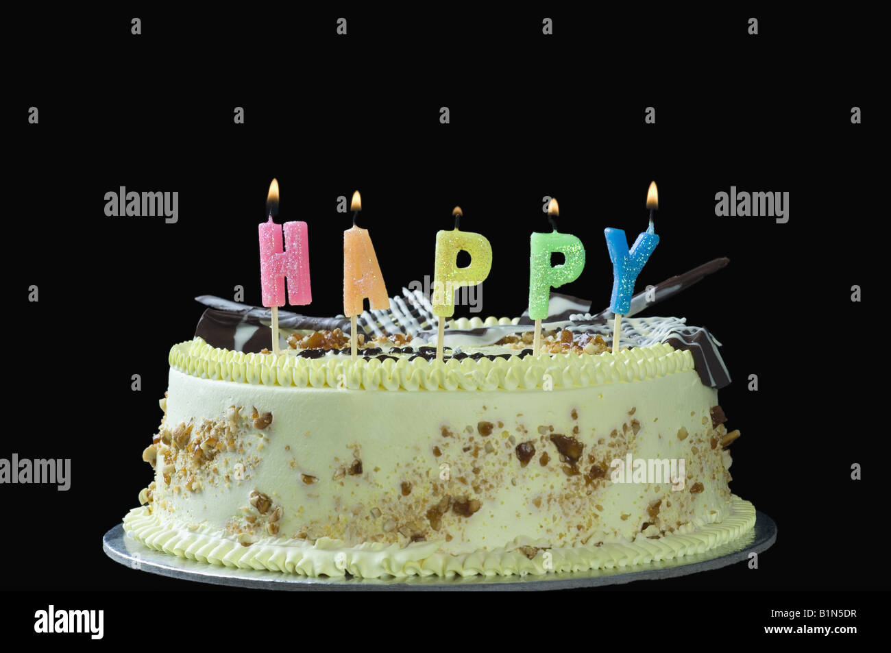 Close-up of lit candles on a birthday cake Stock Photo - Alamy