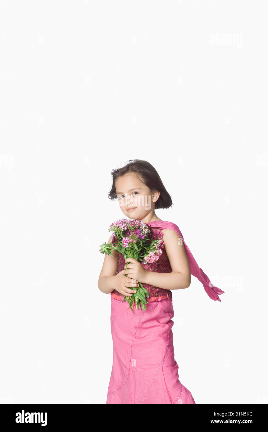 Portrait of a girl holding a bunch of flowers Stock Photo - Alamy