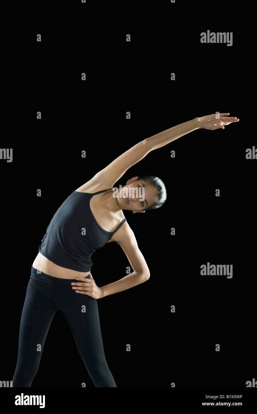 Portrait of a young woman exercising Stock Photo - Alamy