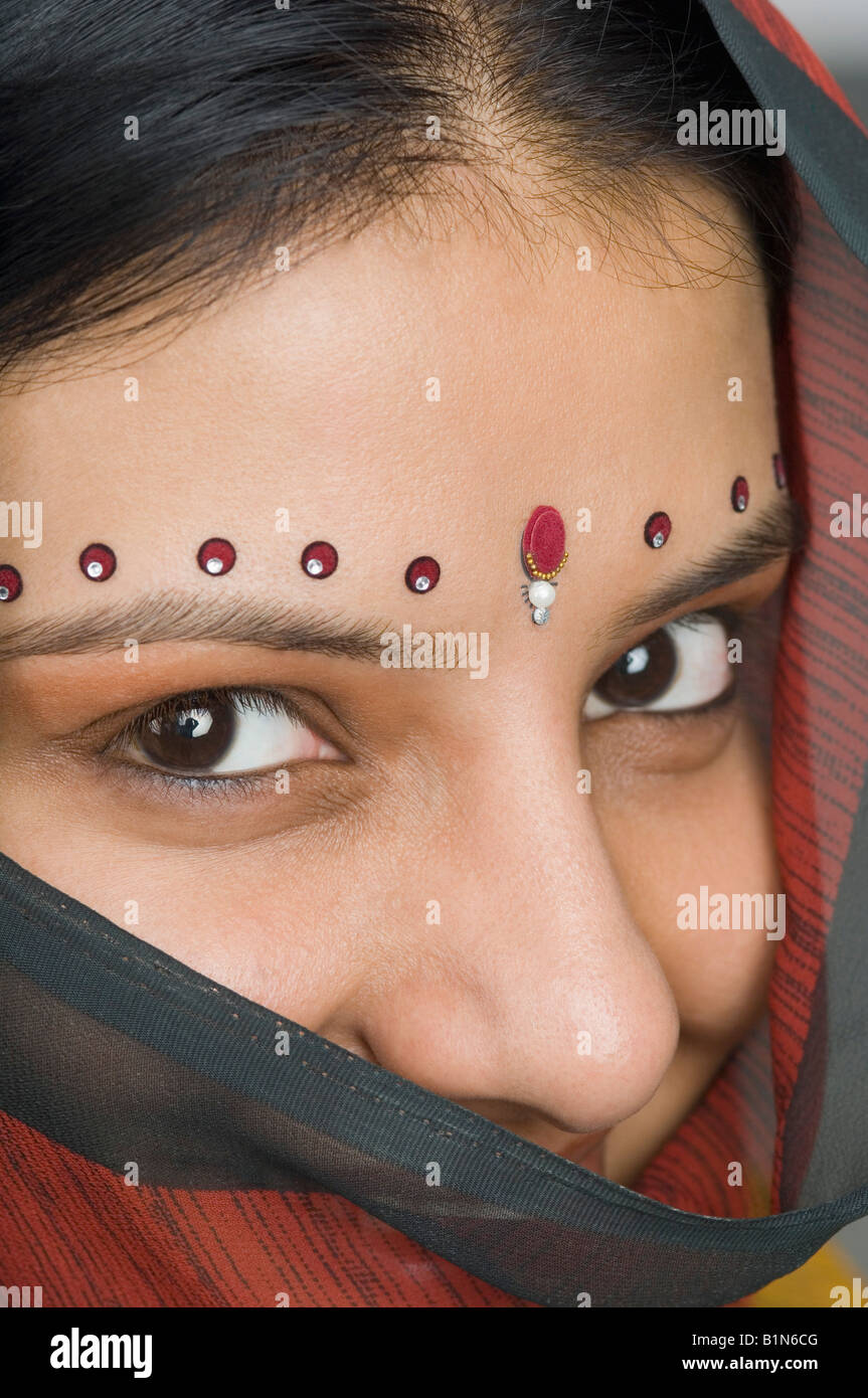 Close-up of bindis on a young woman's forehead Stock Photo