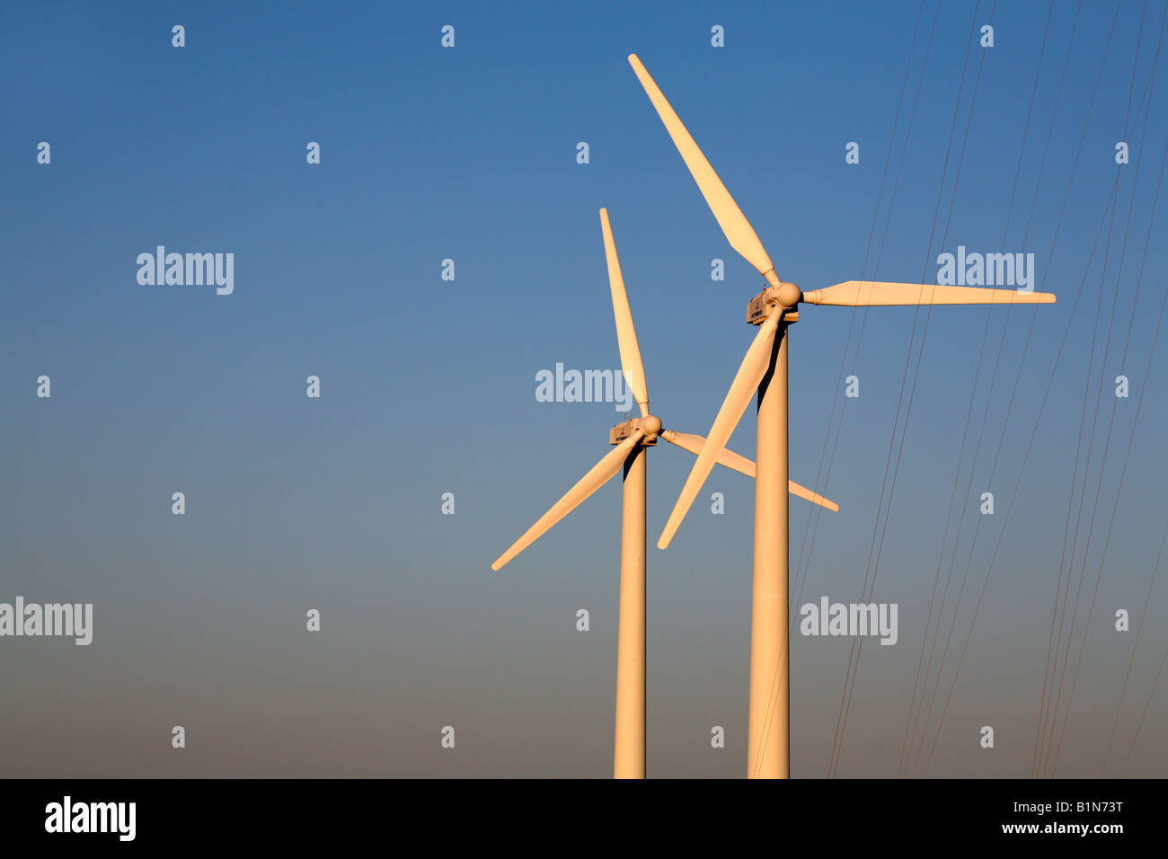 Wind farm turbines against a blue sky Stock Photo - Alamy